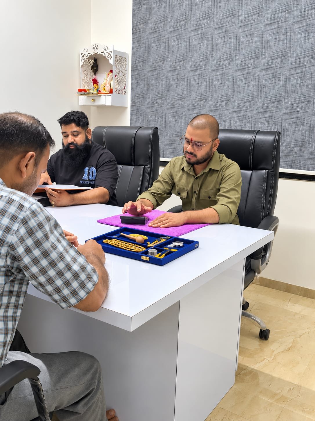 IGT team assessing a customer's gold during a consultation